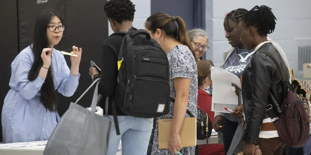 Asylum seekers inquire about legal aid services at Bennetto Community Centre during an outreach event for refugee claimants and asylum seekers in August 2023.