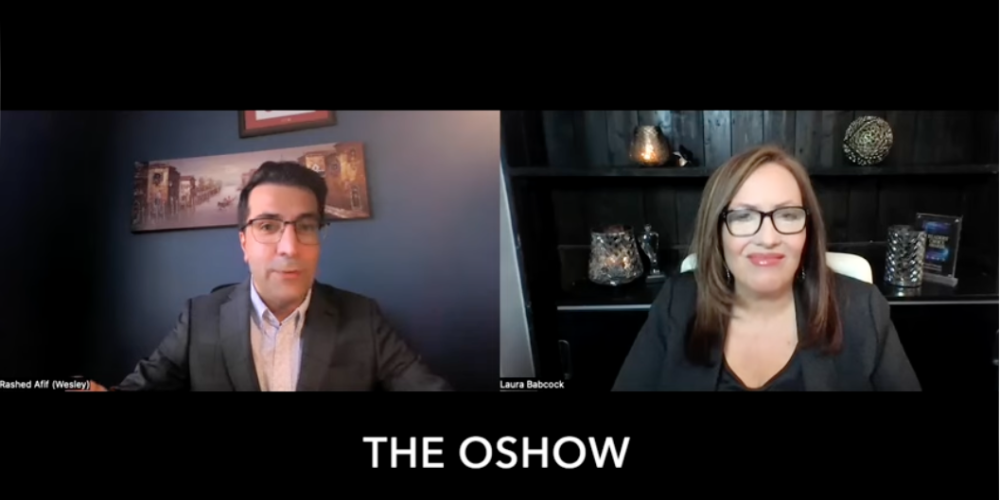 Two people in business attire appear on a split-screen video call with THE OSHOW displayed at the bottom of the image.